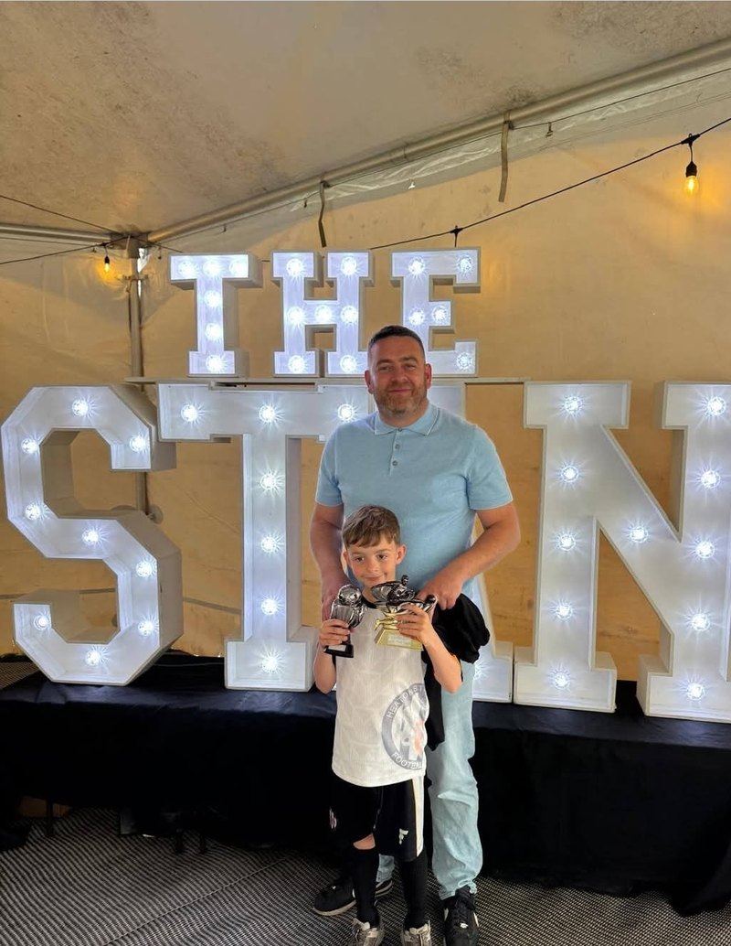 Justin Dobson, creator of sebbi.pro, with his son